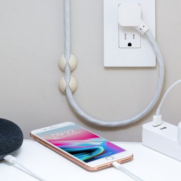 charging cables and adapter plugged into the wall
